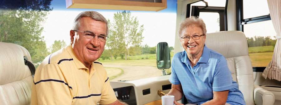 Couple in their motorhome equipped with an onan propane RV generator.