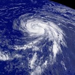 Satellite image showing a tropical cyclone with defined rotation and storm bands.