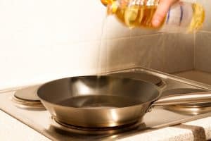 A modern electric stovetop with a pan