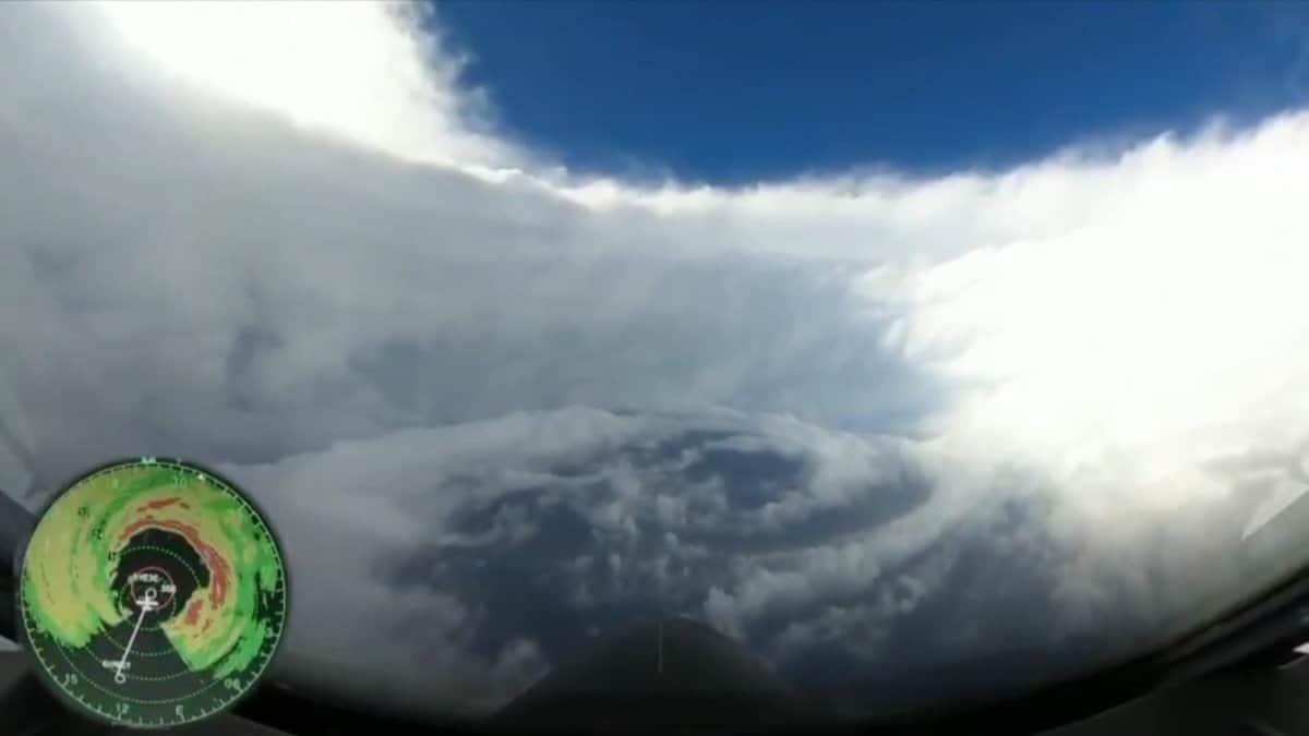 Inside the Eye of Hurricane Epsilon showing Blue Sky Above and Surrounded by the eye wall clouds. NOAA Hurricane Hunter Image