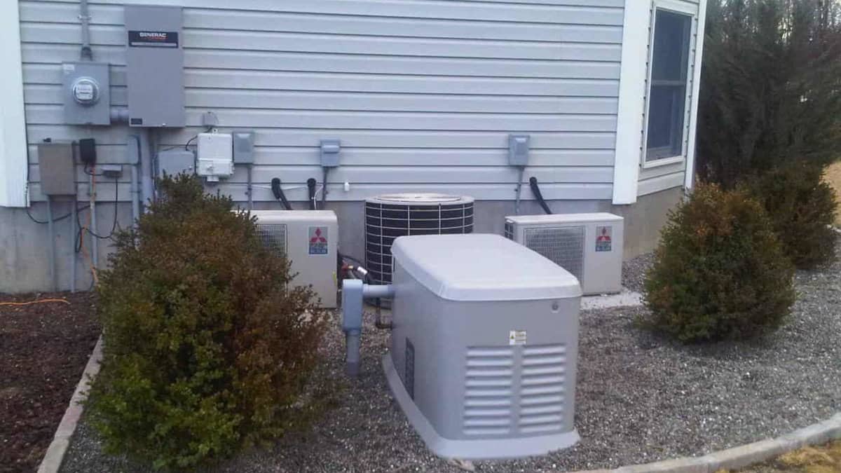 A Generac Standby Generator Installed with Transfer Switch Near the Utility Entrance