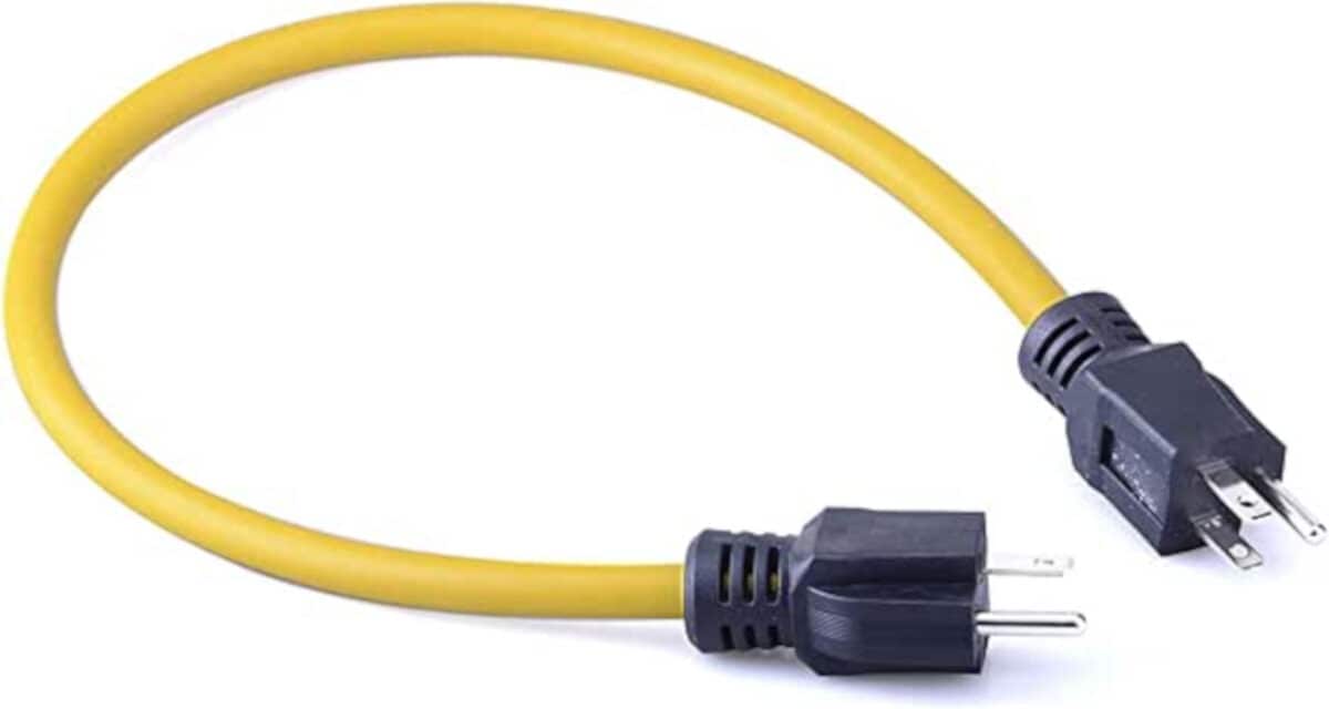 An illegal male-to-male extension cord, yellow with a black plug on each end.