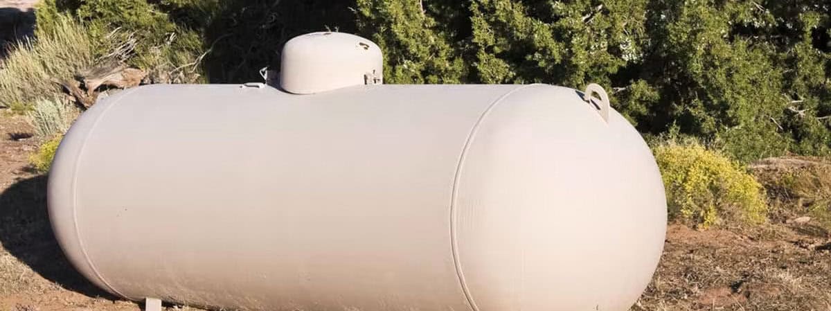 A propane tank for above ground installation supplies propane gas to the home.